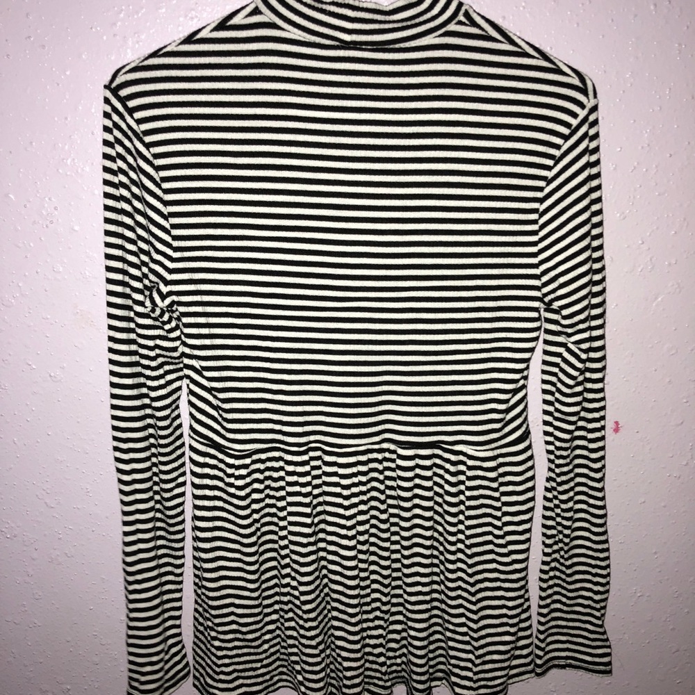 long sleeve peplum turtle neck.